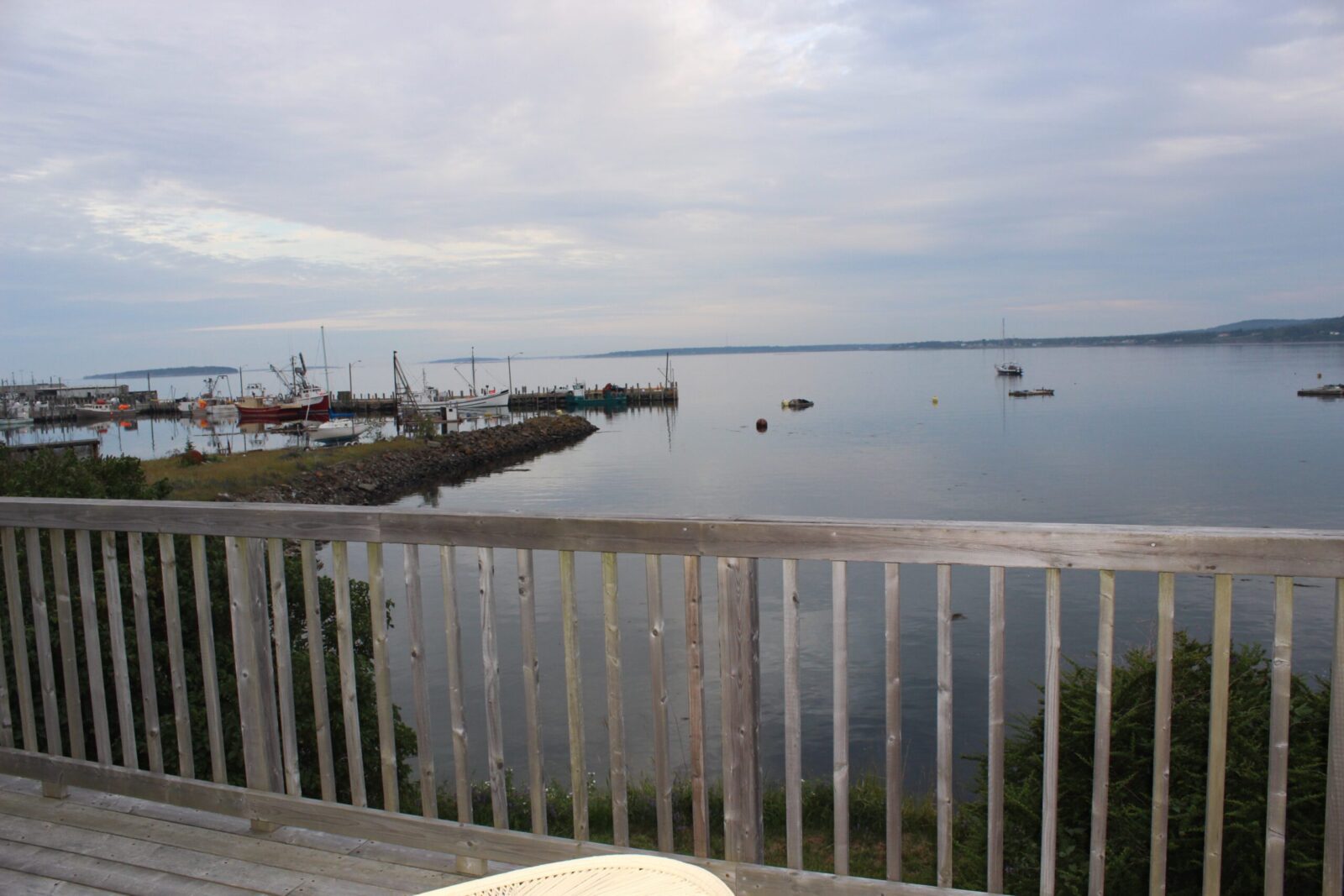 A view of a harbor from a deck.