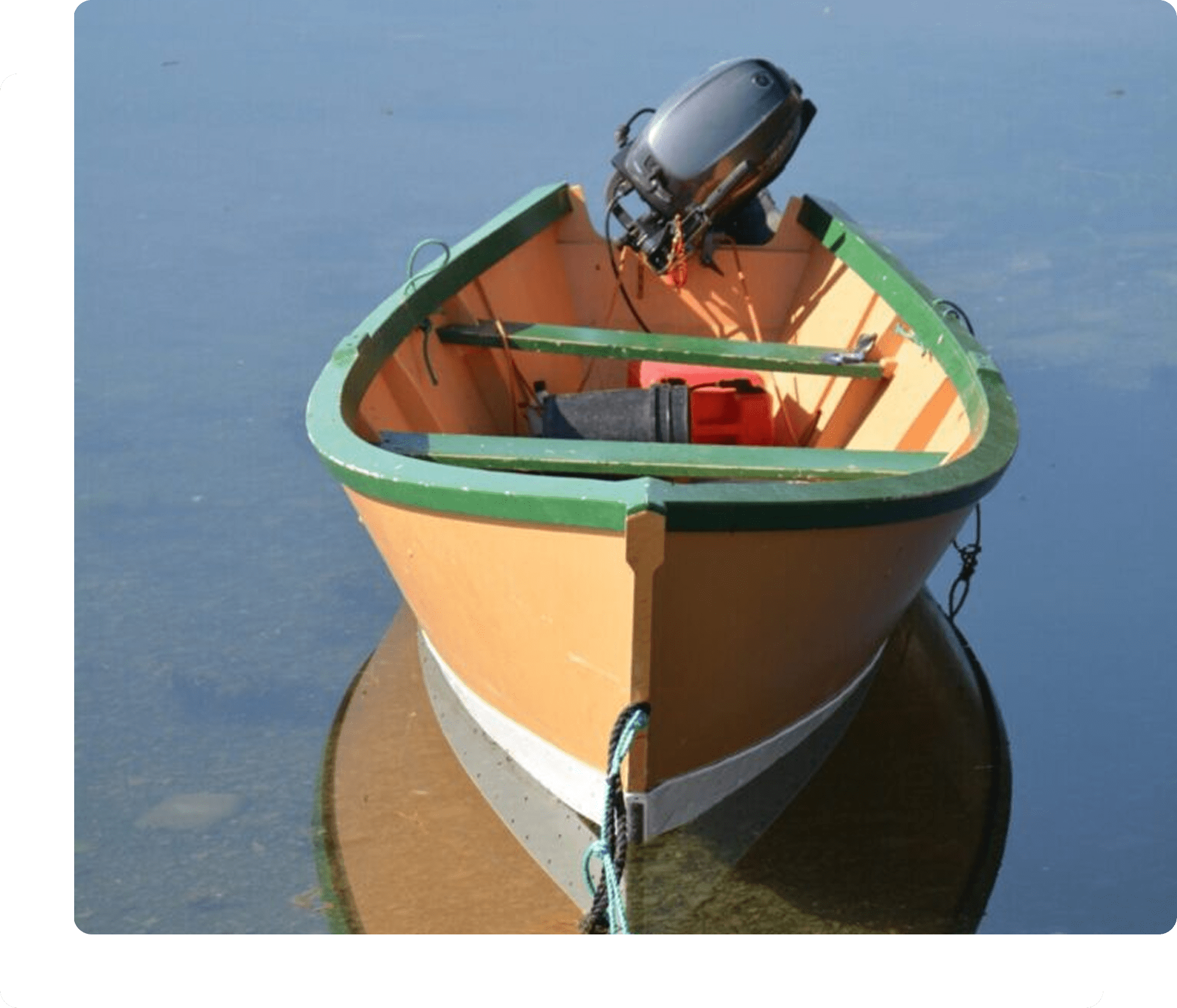 Small boat with an outboard motor.