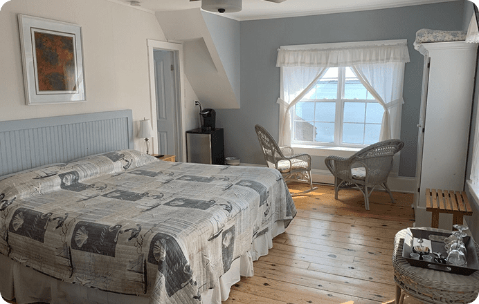Cozy bedroom with wooden floor and window.