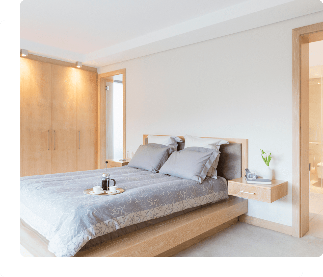 Modern bedroom with a neatly made bed.