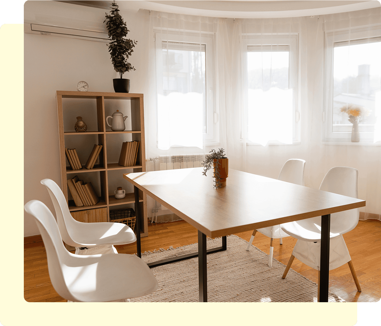 Minimalist room with table and chairs.