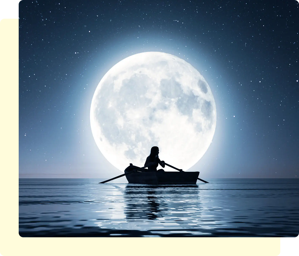 Silhouette rowing boat under full moon.