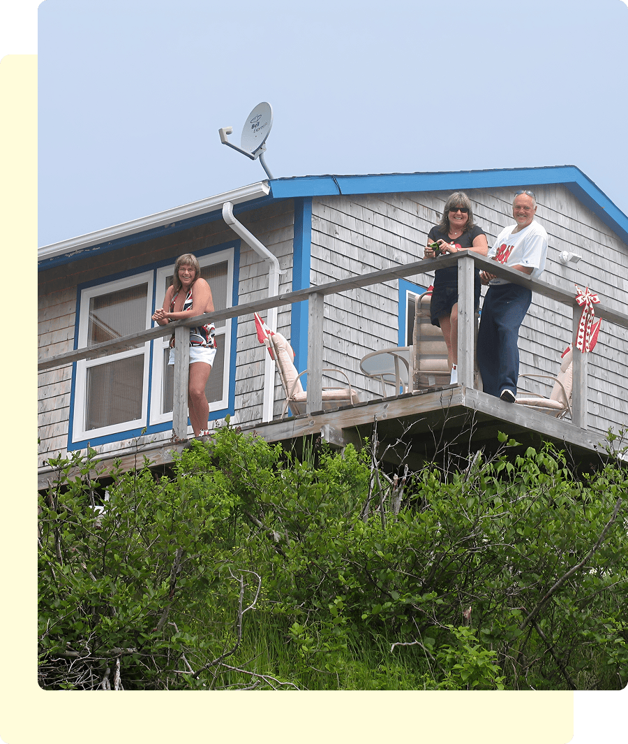 Family enjoying view from wooden balcony