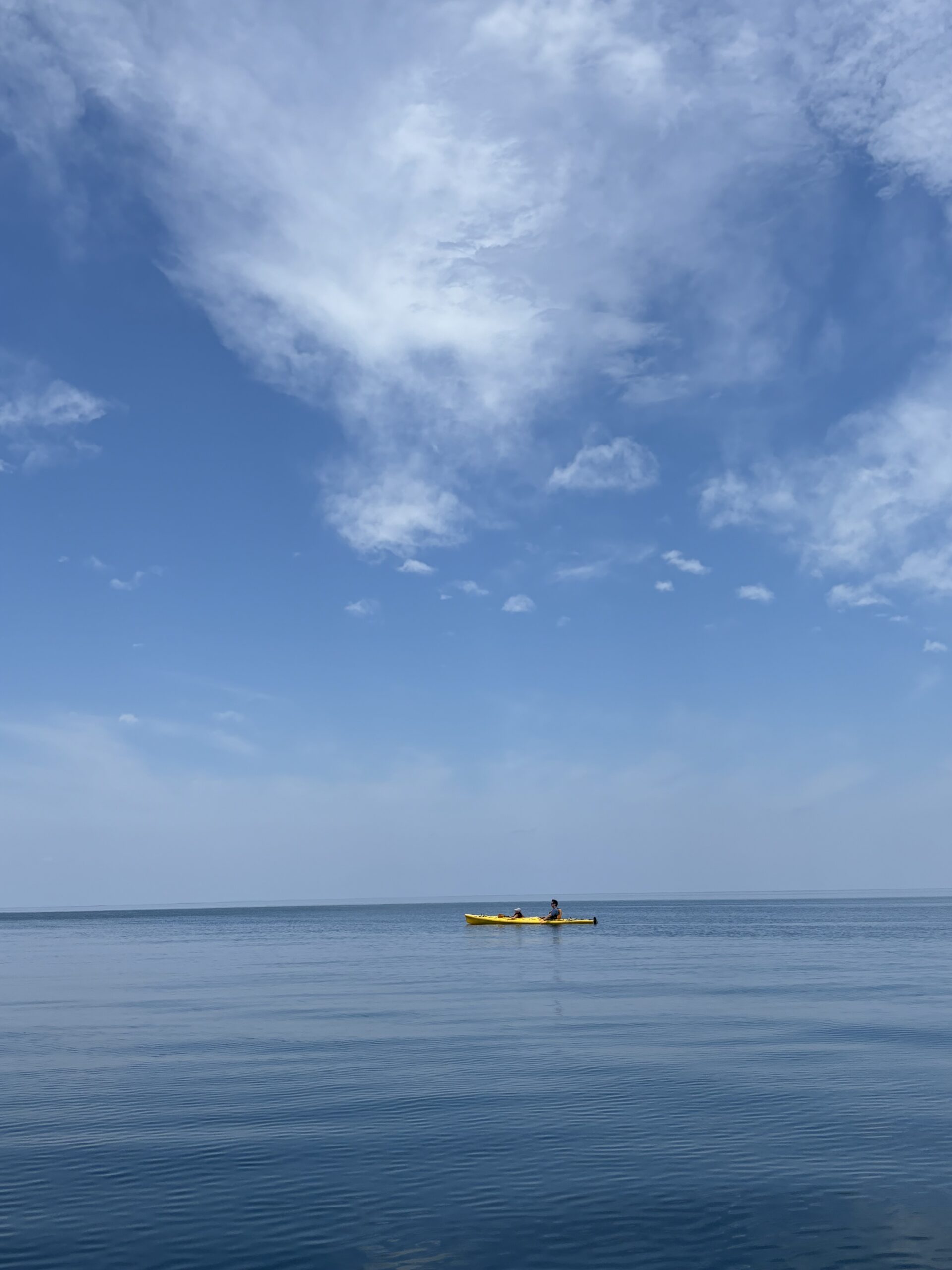 Serene ocean view with lone kayaker