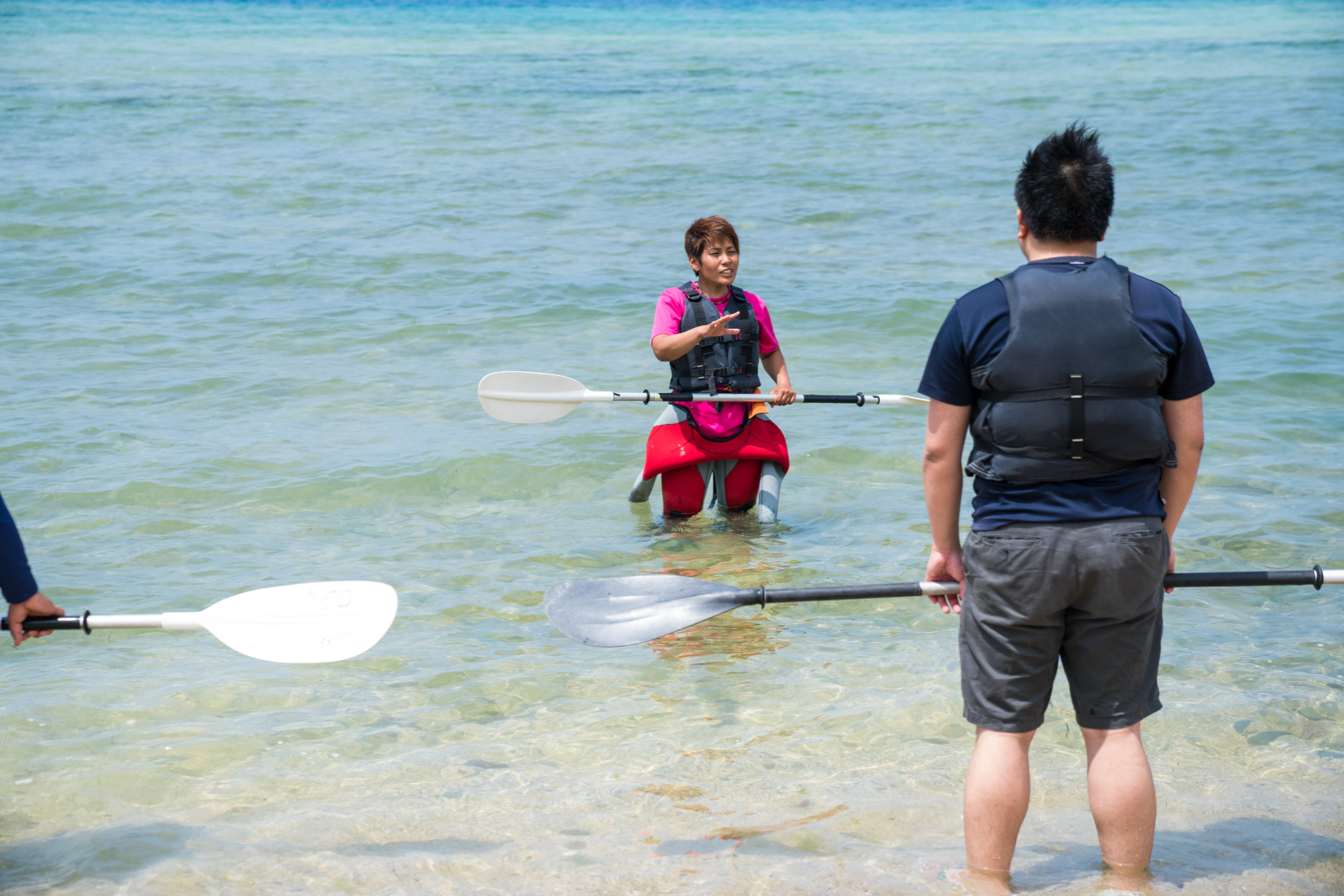 Kayakers preparing in the ocean